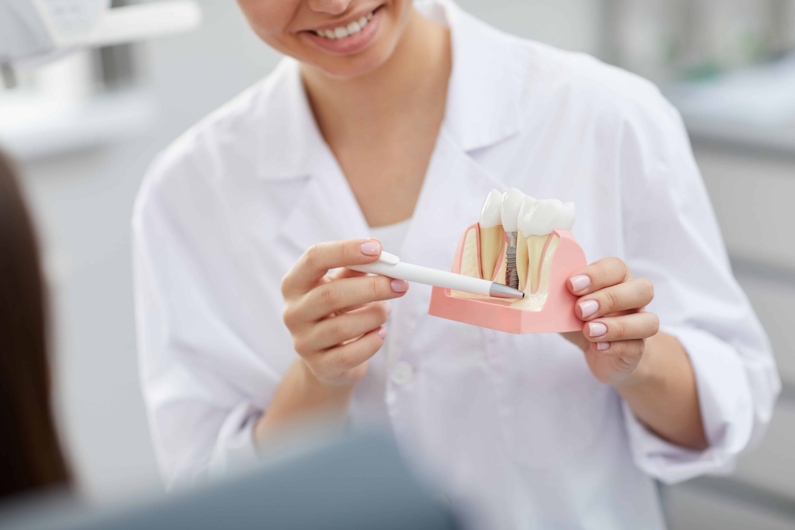 Dentist Explaining Tooth Implantation Process